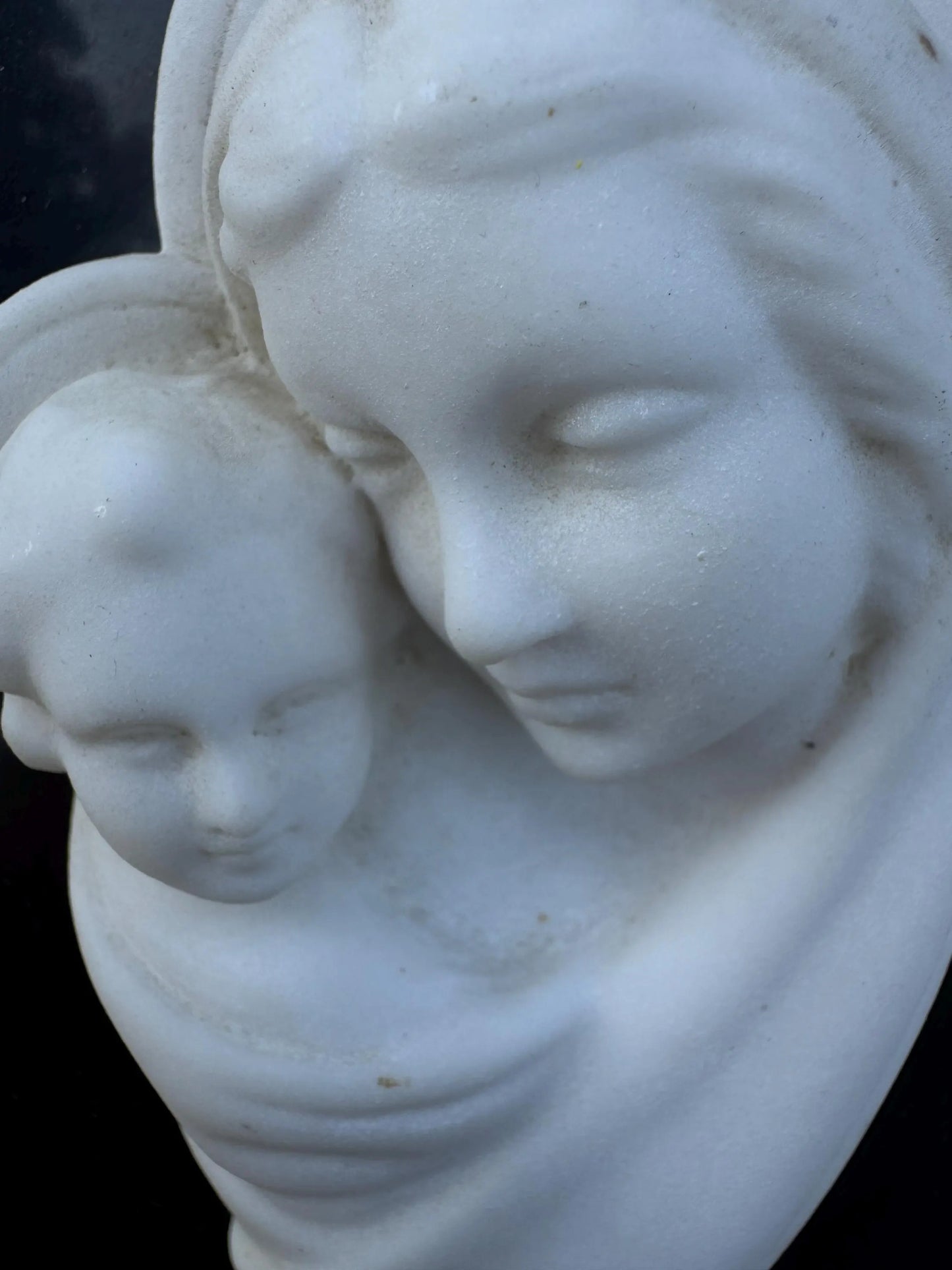 White Marble Relief of Madonna and Child on Black Slab