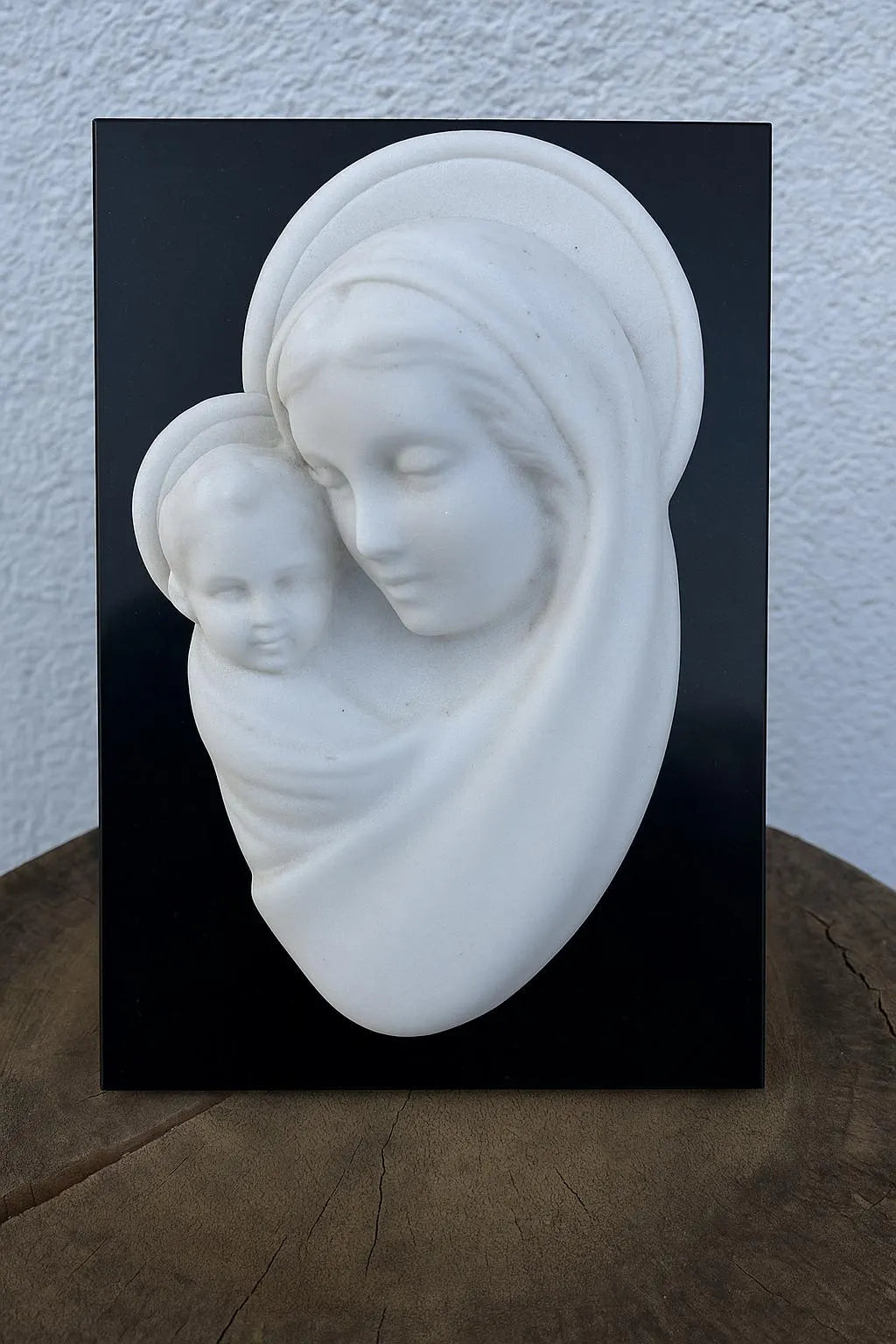 White Marble Relief of Madonna and Child on Black Slab
